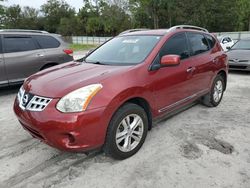 Salvage cars for sale from Copart Fort Pierce, FL: 2012 Nissan Rogue S