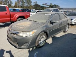 Flood-damaged cars for sale at auction: 2014 Toyota Camry L