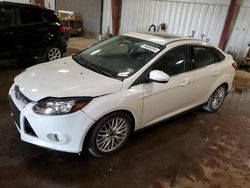 Salvage cars for sale at Lansing, MI auction: 2014 Ford Focus Titanium