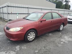 Flood-damaged cars for sale at auction: 2006 Toyota Camry LE