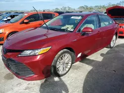 Flood-damaged cars for sale at auction: 2019 Toyota Camry Hybrid