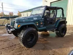 Salvage SUVs for sale at auction: 1999 Jeep Wrangler / TJ Sahara