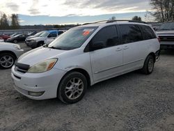 Salvage cars for sale from Copart Arlington, WA: 2004 Toyota Sienna XLE