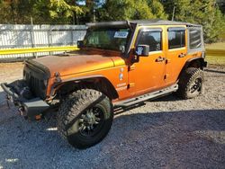 Salvage cars for sale at Greenwell Springs, LA auction: 2011 Jeep Wrangler Unlimited Sport