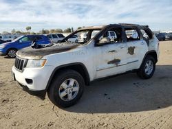 Salvage SUVs for sale at auction: 2011 Jeep Grand Cherokee Laredo