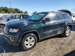 Flood-damaged cars for sale at auction: 2014 Jeep Grand Cherokee Laredo