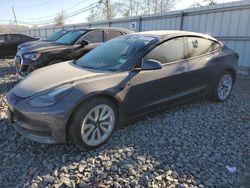 Carros dañados por inundaciones a la venta en subasta: 2022 Tesla Model 3