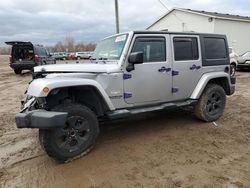 Salvage cars for sale from Copart Portland, MI: 2014 Jeep Wrangler Unlimited Sahara