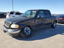 Salvage trucks for sale at Wilmer, TX auction: 2001 Ford F150 Supercrew