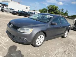 Salvage cars for sale at Opa Locka, FL auction: 2011 Volkswagen Jetta SE