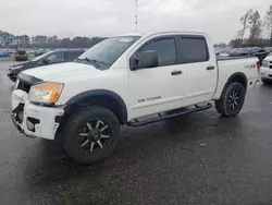 Salvage SUVs for sale at auction: 2011 Nissan Titan S