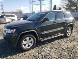 Salvage SUVs for sale at auction: 2011 Jeep Grand Cherokee Laredo