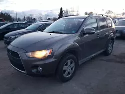 Salvage cars for sale from Copart Bowmanville, ON: 2011 Mitsubishi Outlander SE