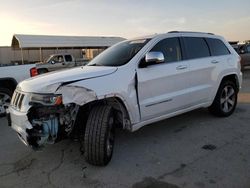 Salvage cars for sale from Copart Fresno, CA: 2014 Jeep Grand Cherokee Overland