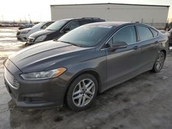 Salvage cars for sale from Copart Rocky View County, AB: 2016 Ford Fusion SE