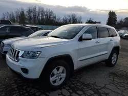 Salvage SUVs for sale at auction: 2011 Jeep Grand Cherokee Laredo