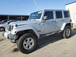 Salvage cars for sale at Fresno, CA auction: 2012 Jeep Wrangler Unlimited Sahara