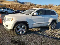 Salvage SUVs for sale at auction: 2011 Jeep Grand Cherokee Overland