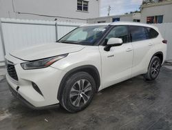 Salvage cars for sale at Opa Locka, FL auction: 2021 Toyota Highlander Hybrid XLE